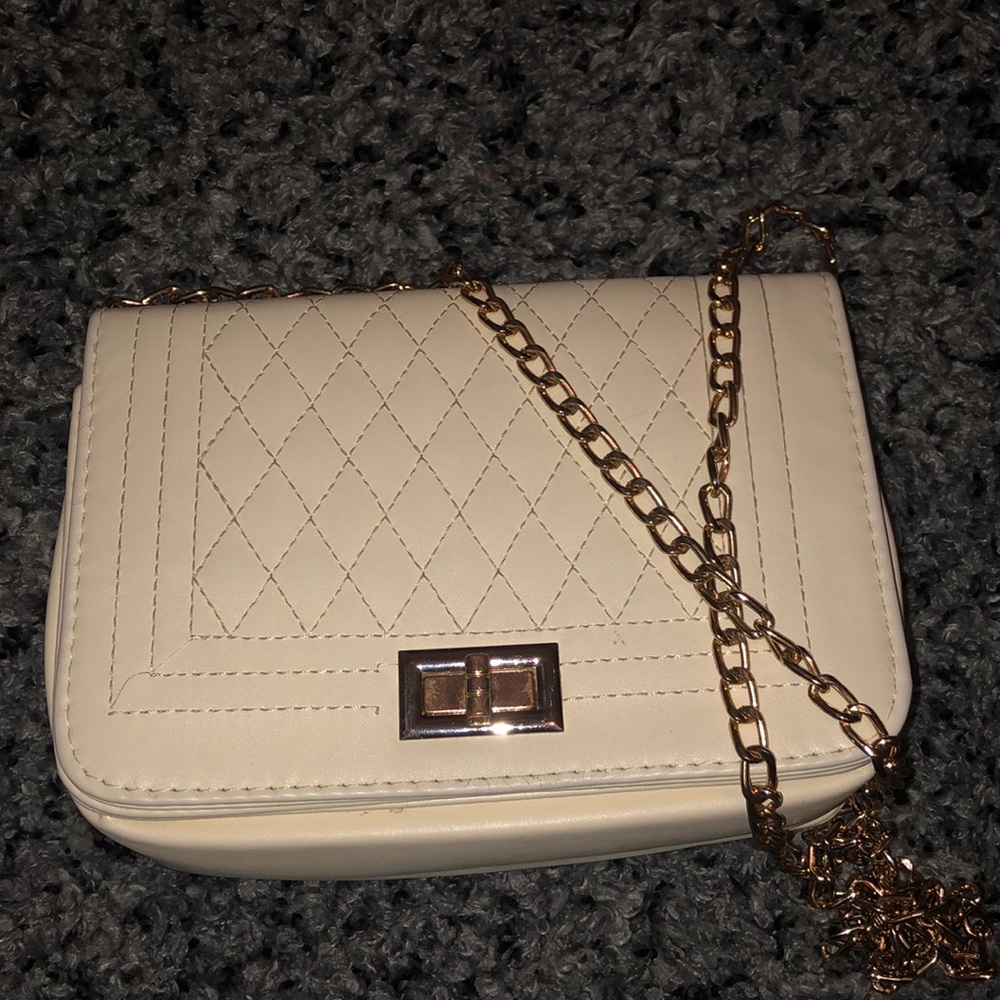 White purse with gold chain